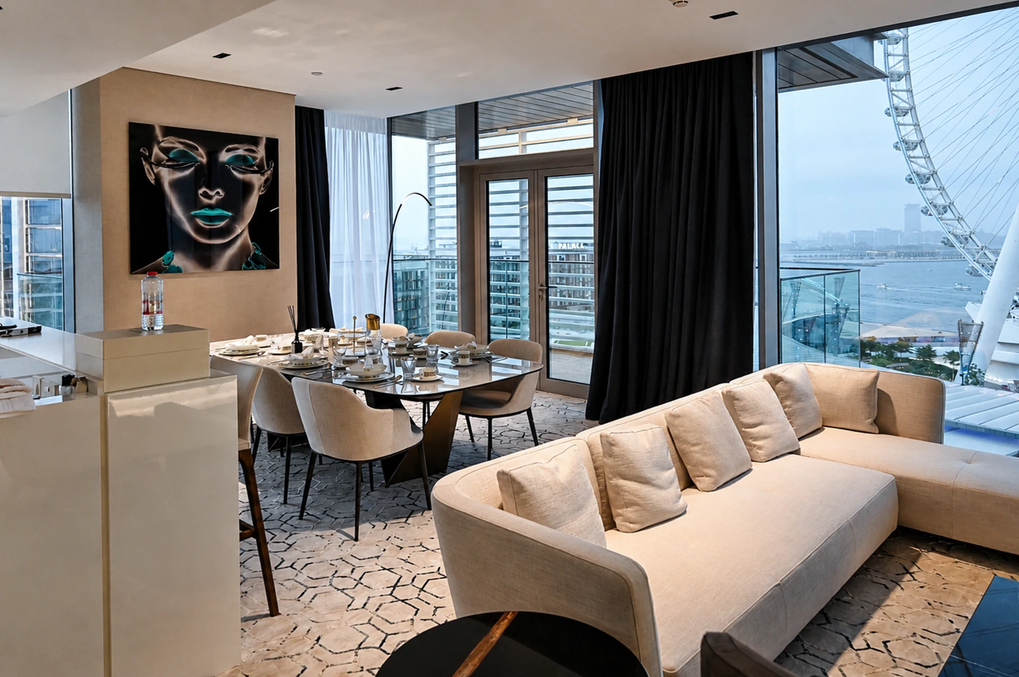 Dining, portrait artwork and kitchen island — apartment interior in Dubai by Soltis Interiors