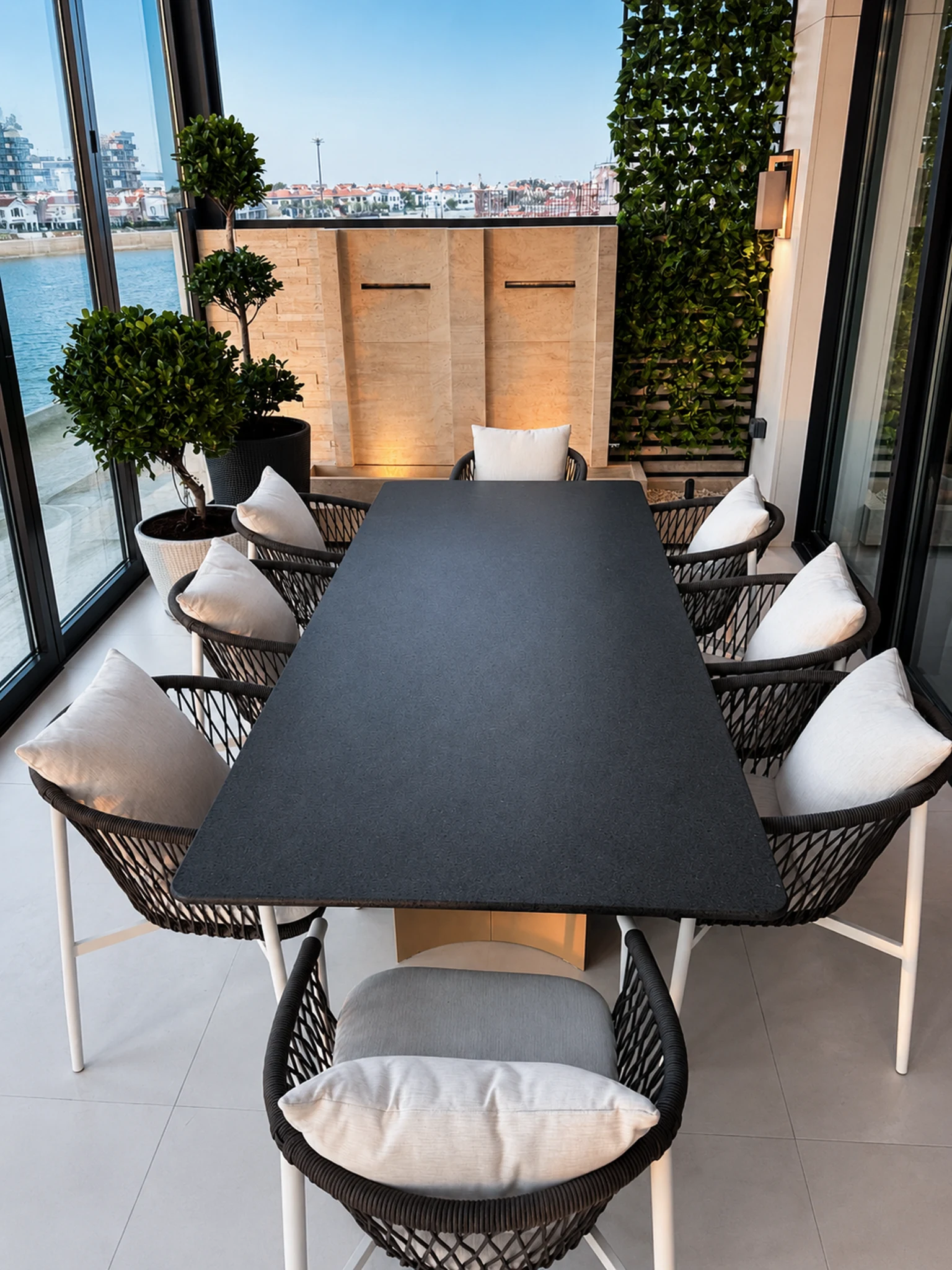 Terrace, woven sofa and garden — mansion interior in Dubai by Soltis Interiors